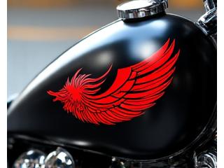 Motorcycle gas tank with a large, stylized phoenix graphic